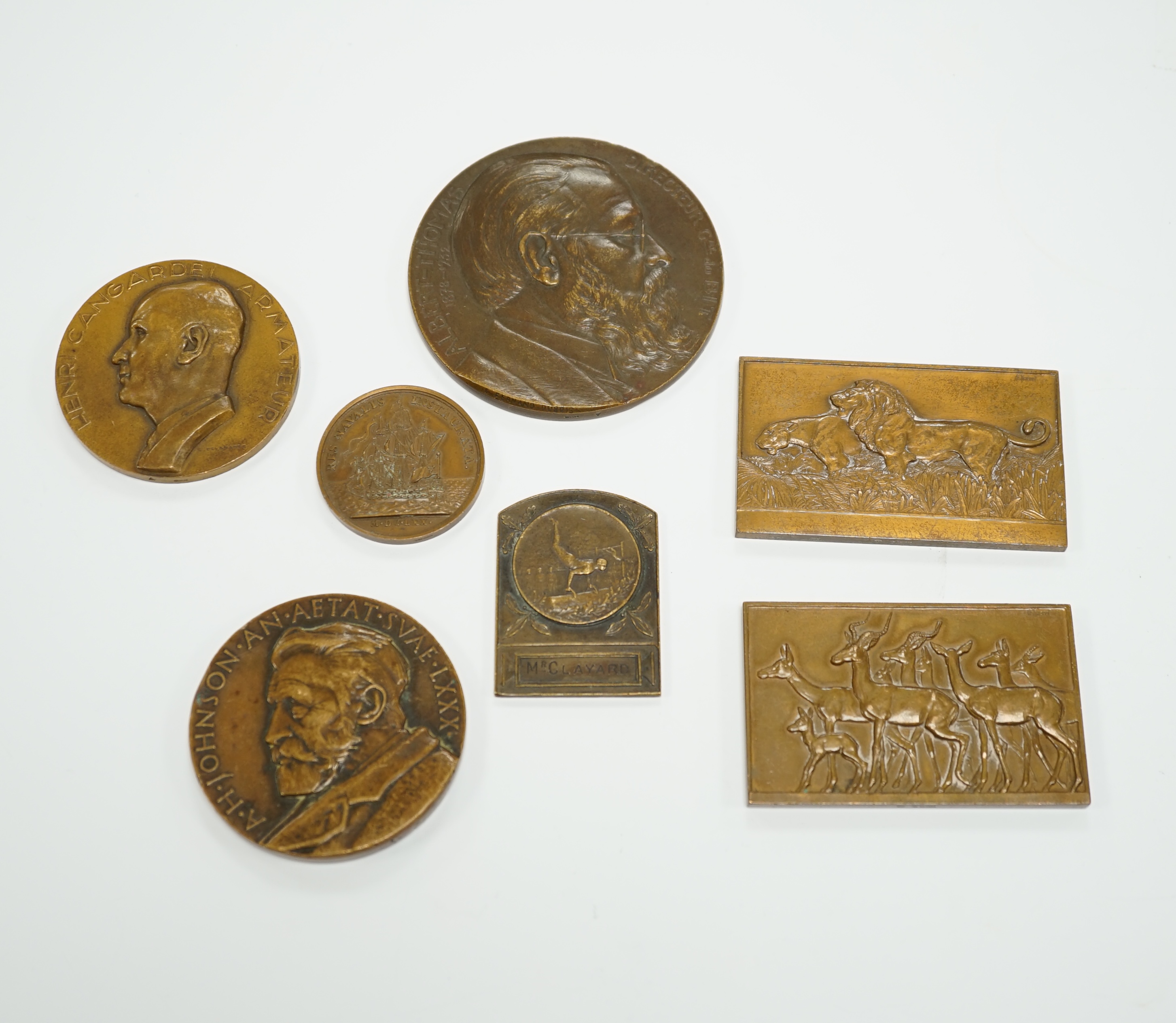 Seven bronze medallions, including awards and commemorative pieces; A.H. Johnson, Henri Cangardel, Albert Thomas, etc., largest 8 cm diameter